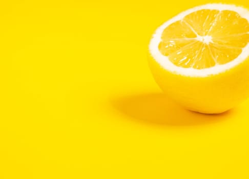 lemon fruits. Juicy slice of lemon on yellow background isolated. panoramic mock up image. Yellow lemon close up. place for text. Fresh cut lemon. High quality photo