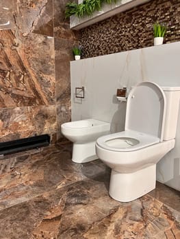 an public toilet in an public building. white outdoor toilet. High quality photo