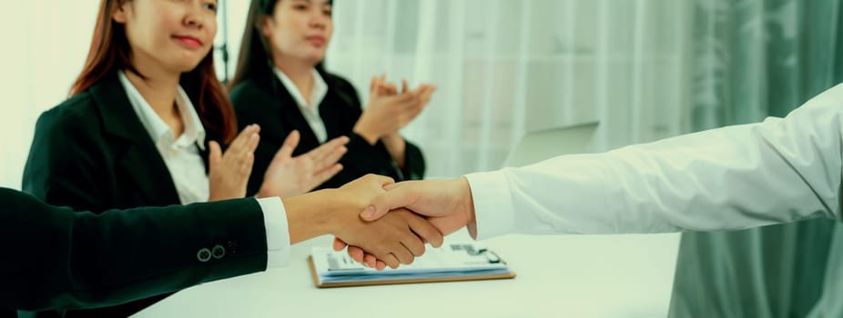 Business people group handshake at meeting table. Job interview success or making successful business oratory agreement