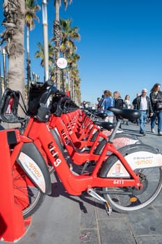 Barcelona, Spain: November 19, 2023: Public Bicycle Service in Barcelona on the beach of La Barceloneta in the capital of Catalonia in Spain in 2023.