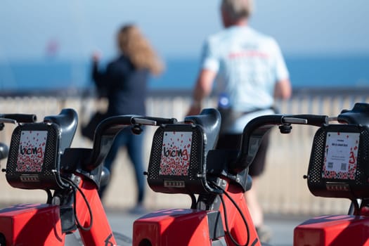 Barcelona, Spain: November 19, 2023: Public Bicycle Service in Barcelona on the beach of La Barceloneta in the capital of Catalonia in Spain in 2023.