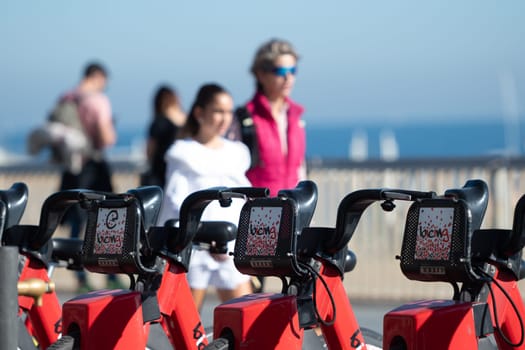 Barcelona, Spain: November 19, 2023: Public Bicycle Service in Barcelona on the beach of La Barceloneta in the capital of Catalonia in Spain in 2023.