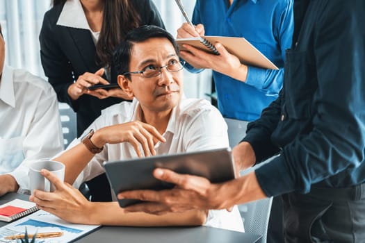 Group of diverse office worker employee working together on strategic business marketing planning in corporate office room. Positive teamwork in business workplace concept. Prudent