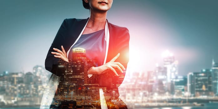 Double Exposure Image of Business Person on modern city background. Future business and communication technology concept. Surreal futuristic cityscape and abstract multiple exposure interface. uds