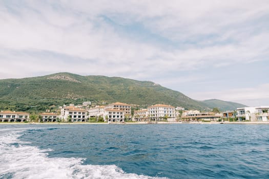 View from the sea to the beach near the villas of the One and Only hotel complex. Portonovi, Montenegro. High quality photo