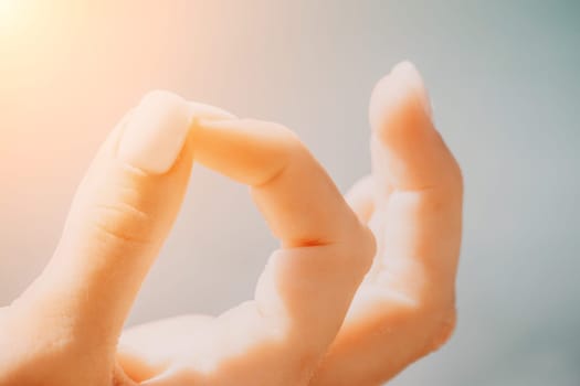 Close up Hand Gesture of Woman Doing an Outdoor Lotus Yoga Position. Close up. Blurred background