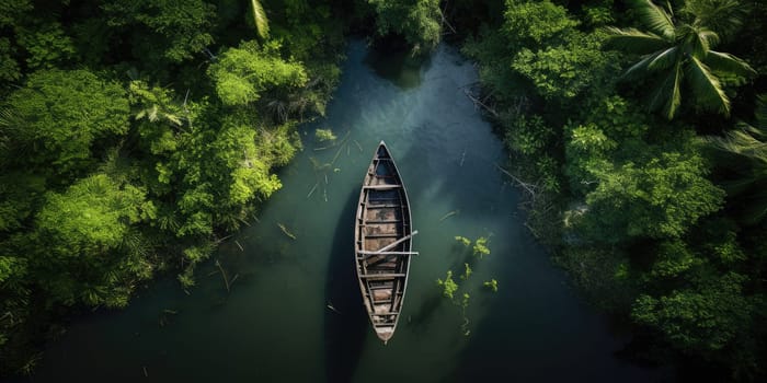 Top view to an abandoned boat on the river in the forest or jungle