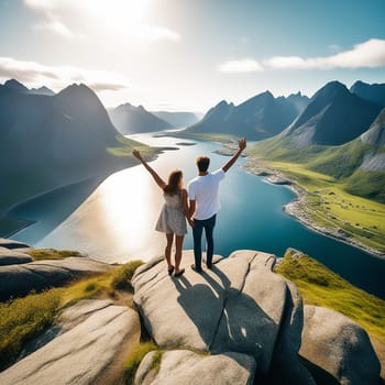 Happy Couple Raises Hands on Cliff in Norway - Family Travelers Embrace the Lifestyle Concept of Summer Vacations in the Outdoor Lofoten Islands