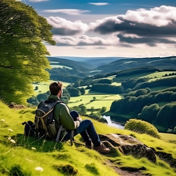 Hiker Taking a Rest and Enjoying the Beautiful English Countryside Landscape - Relaxation, Peace, and Serenity