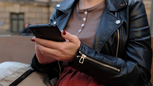 Attractive Woman Typing Message On City Street Showcases Concept Of Social Media In Everyday Life