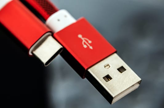 Red connectors usb and usb type C for smartphones and gadgets closeup. Plug micro cable for mobile devices in macro view