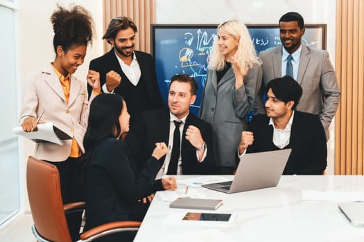 Multicultural businesspeople brainstorming business idea together. Diverse professional business team working together, sharing, planing idea, strategy. Meeting room, laptop, presentation. Ornamented.