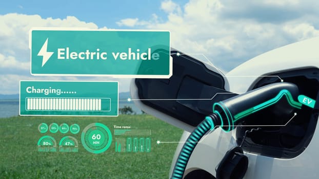 Electric car plug in with charging station, recharge battery by EV charger cable display smart digital battery status hologram with nature background. Futuristic green energy infrastructure.Peruse