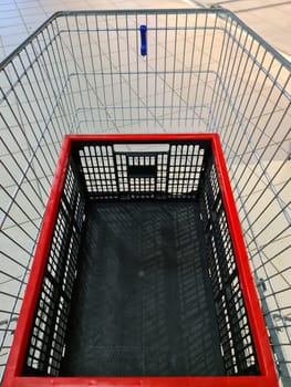 An empty shopping cart with a box in it
