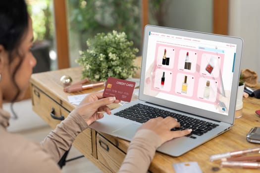 Woman shopping online on internet marketplace browsing for sale items for modern lifestyle and use credit card for online payment from wallet protected by crucial cyber security software