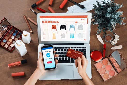 Woman shopping online on internet marketplace browsing for sale items for modern lifestyle and use credit card for online payment from wallet protected by utmost cyber security software