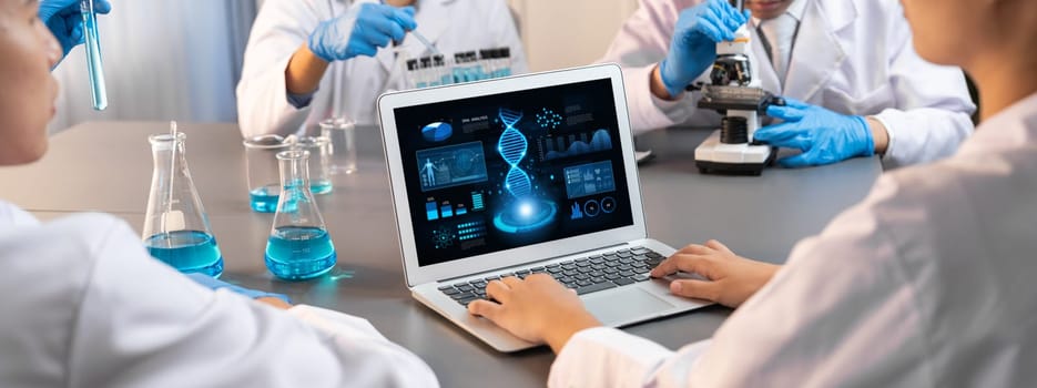 Dedicated scientist group working on advance biotechnology computer software to study or analyze DNA data after making scientific breakthrough from chemical experiment on medical laboratory. Neoteric