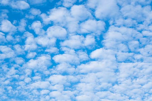 Beautiful sky with clouds and sun on a summer day. Time lapse of clouds above the blue sky with the sun shining. Sky nature background.