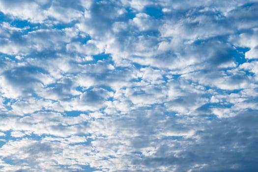 Beautiful sky with clouds and sun on a summer day. Time lapse of clouds above the blue sky with the sun shining. Sky nature background.