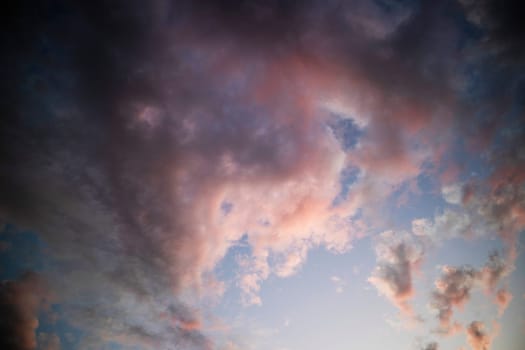 Photographic documentation of a group of colored clouds taken at sunset 