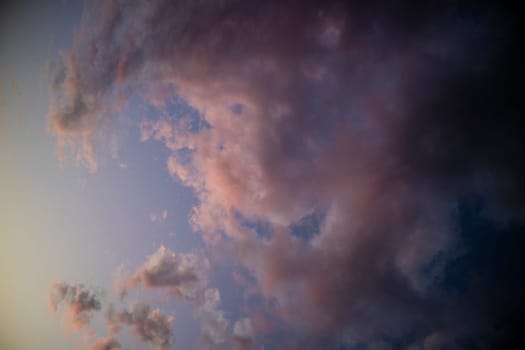 Photographic documentation of a group of colored clouds taken at sunset 