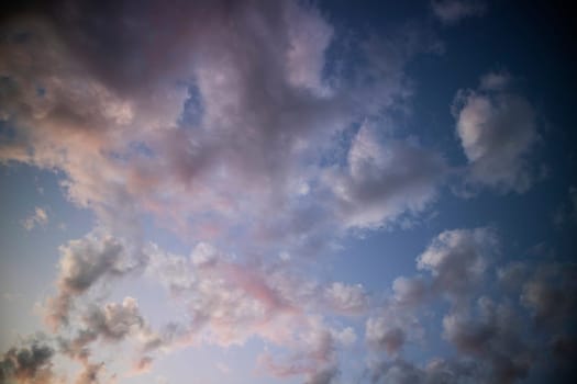 Photographic documentation of a group of colored clouds taken at sunset 