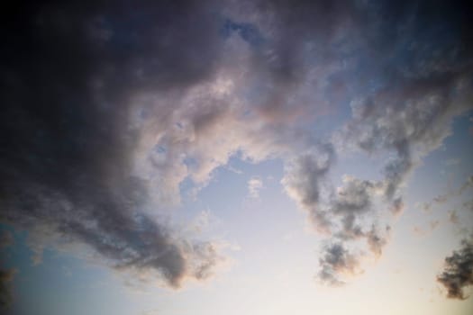 Photographic documentation of a group of colored clouds taken at sunset 