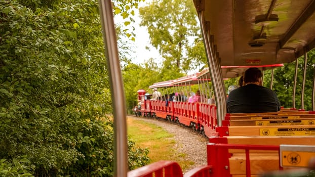 Steam locomotive and narrow gauge railroad at the Safari park on a sunny spring day. African Lion Safari park in Canada