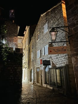 Signboard on an old stone building. Caption: Freedom. Hostel. High quality photo