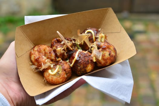 fried Japanese balls of fish tofu and squid in a box