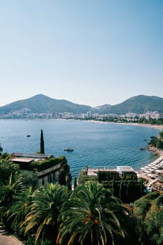 Villas with terraces in a green garden on the seafront with a private beach. Hotel Dukley, Budva, Montenegro. High quality photo