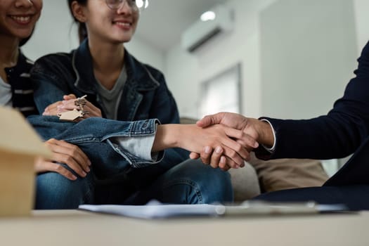 Real estate broker agent manager shaking hands with a client after successful agreement.