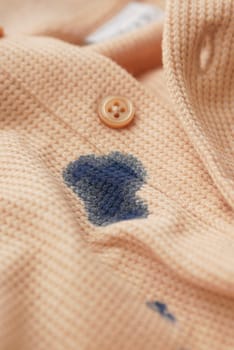 closeup of shirt with blue ink stain ..