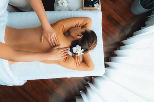 Panorama top view woman customer enjoying relaxing anti-stress spa massage and pampering with beauty skin recreation leisure in day light ambient salon spa at luxury resort or hotel. Quiescent