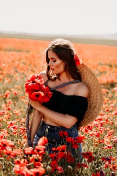 Woman poppies field. portrait of a happy woman with long hair in a poppy field and enjoying the beauty of nature in a warm summer day