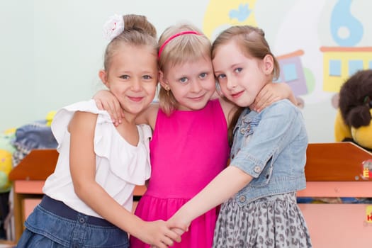 Belarus, Gomel, May 29, 2018. The kindergarten is central. Open Day.Three girl friends preschool girls.Girls from kindergarten