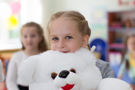 Belarus, Gomel, May 29, 2018. The kindergarten is central. Open Day.Little girl with a teddy bear