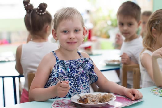 Belarus, Gomel, May 29, 2018. The kindergarten is central. Open Day.The child eats in a kindergarten.