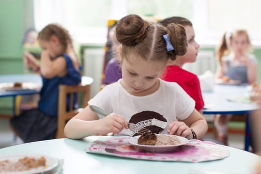Belarus, Gomel, May 29, 2018. The kindergarten is central. Open Day.The child eats in a kindergarten.Poor appetite.The child does not want to eat food