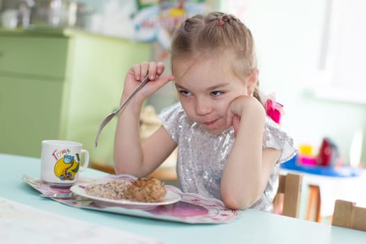 Belarus, Gomel, May 29, 2018. The kindergarten is central. Open Day.Сhild does not want to eat. Bad appetite. Eating in kindergarten
