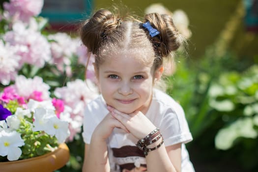 Belarus, Gomel, May 29, 2018. The central kindergarten. Open day.Portrait of a preschool girl with flowers