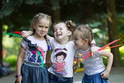 Belarus, Gomel, May 29, 2018. The kindergarten is central. Open Day.Funny preschool girls play on the street. Happy children.;