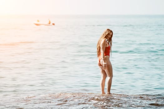 Woman sea yoga. Back view of free calm happy satisfied woman with long hair standing on top rock with yoga position against of sky by the sea. Healthy lifestyle outdoors in nature, fitness concept.