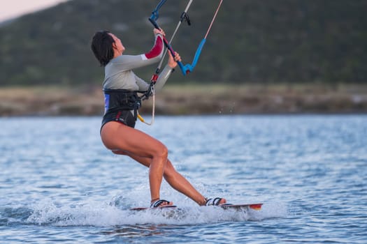 Gulbahce,Urla,Izmir,Turkey - July 30, 2023, People kite surf at the beach on a sunny afternoon in Gulbahce , Urla Izmir. High quality photo