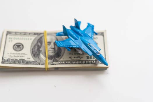 Toy plane and money on background. Travel insurance. High quality photo