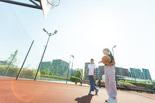 children schoolchildren playing a match about basketball against the background. High quality photo