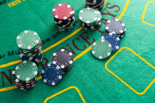 A royal flush poker hand with chips and green felt table copy space for your text. High quality photo