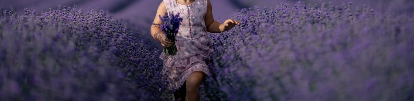 Lavender field girl banner. happy girl in pink dress runs through a lilac field of lavender. Aromatherapy concept, lavender oil, photo session in lavender.