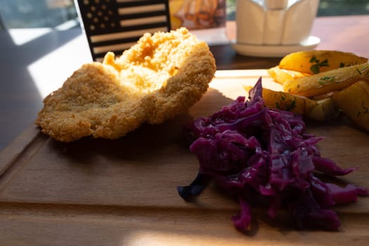 serving cutlets with salad on a wooden board. High quality photo