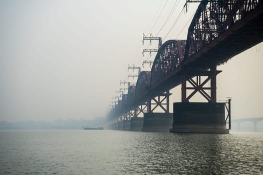 Hardinge Bridge in fog steel railway truss bridge over the Padma River, Bangladesh